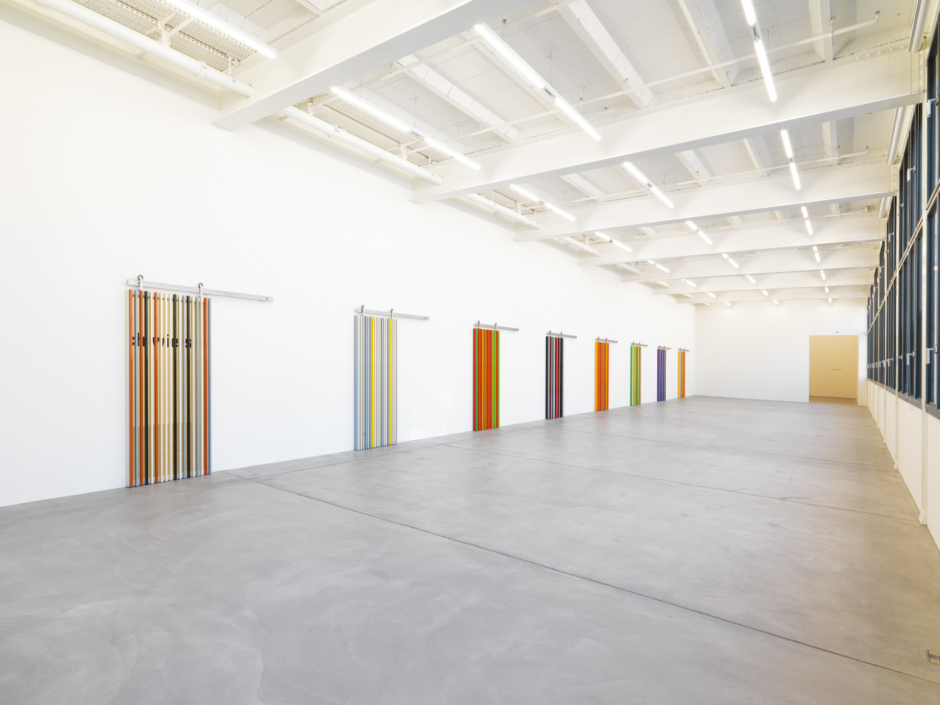 Installation view of Liam Gillick wall-based graphic works and wall hangings exhibition