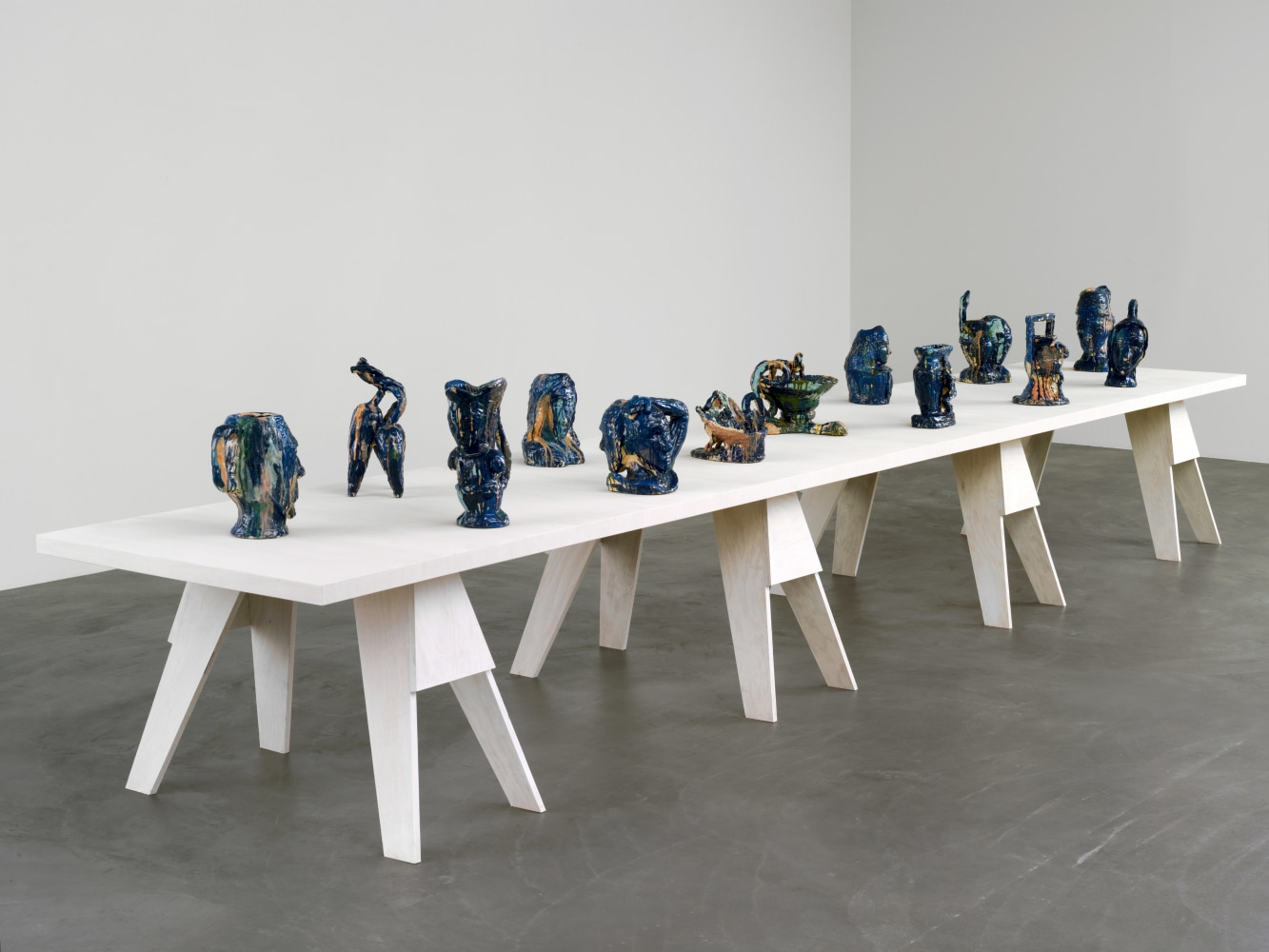 Group of sculptures by Andrew Lord on table