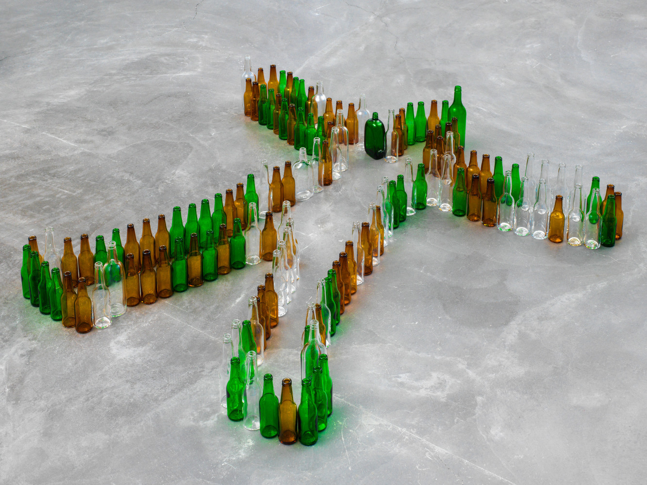 Valentin Carron Bottle Man (Blithely) 2017 145 bottles made of handblown glass 31 x 183 x 189 cm / 12 1/4 x 72 x 74 3/8 in