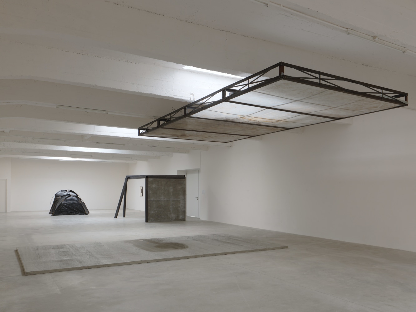 Installation view of sculptures by Oscar Tuazon