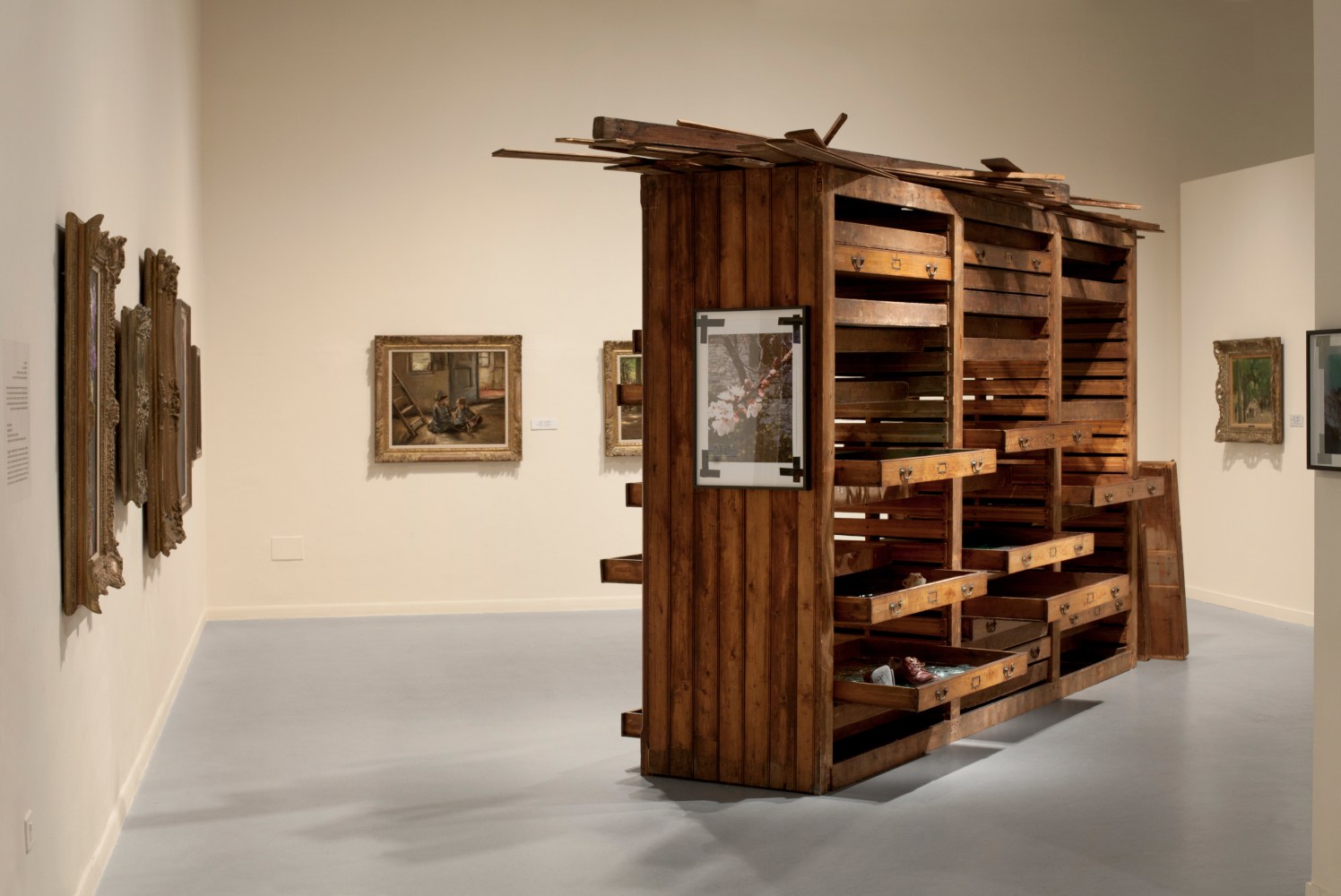 Installation view of photographs and sculptures by Douglas Gordon