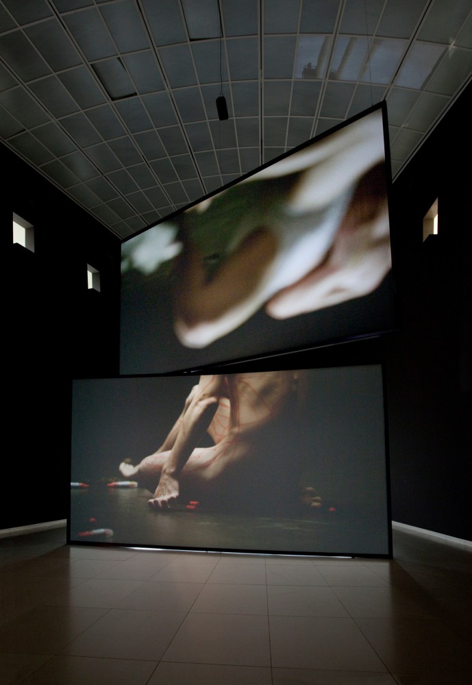 Douglas Gordon henry rebel burning and drawing 2011 HD-Video installation with sound (ratio 16:9); 2-part Sandwich screen projection (Technical equipment is not included) Edition of 3 The screen size is variable – dependent on the size of the space but has a minimum size of (2x) 281 x 500 cm / 110 5/8 x 196 7/8 in Minimum room size 700 x 1200 x 1200 cm / 275 5/8 x 472 1/2 x 472 1/2 in