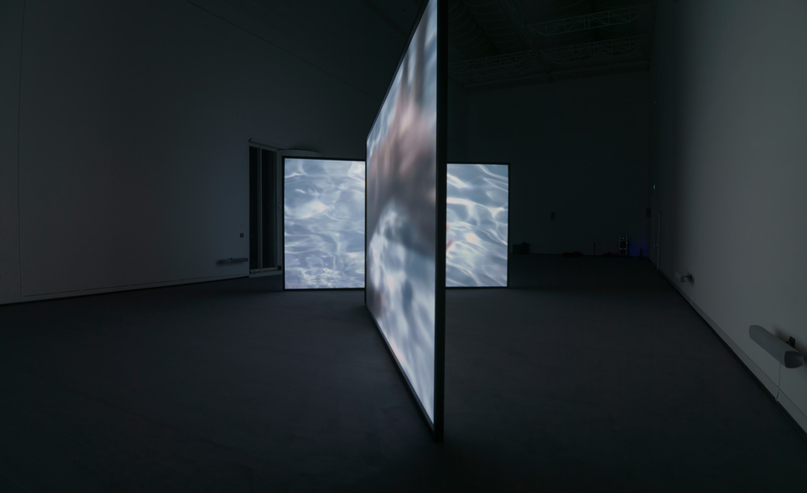 Installation view of video work by Douglas Gordon