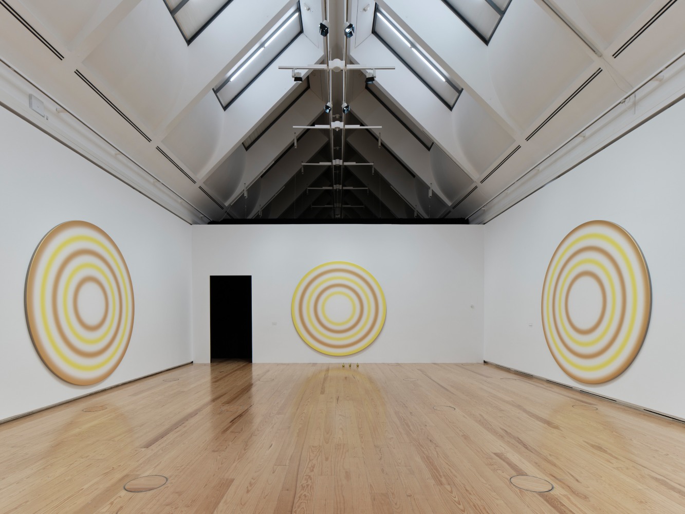 Installation view of paintings and sculptures by Ugo Rondinone