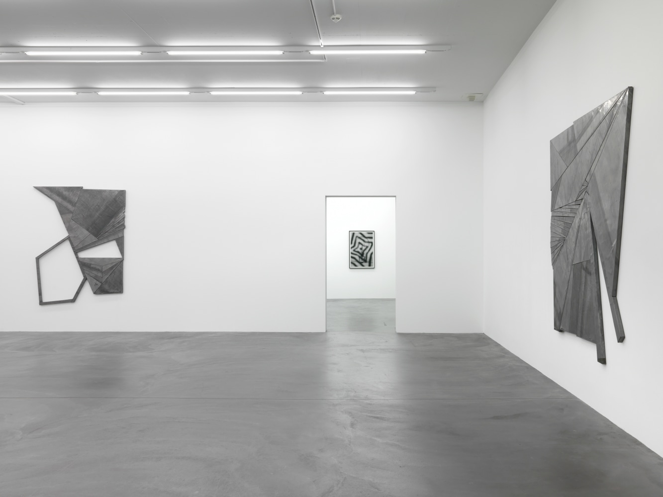 Installation view of Wyatt Kahn wall reliefs and photographs