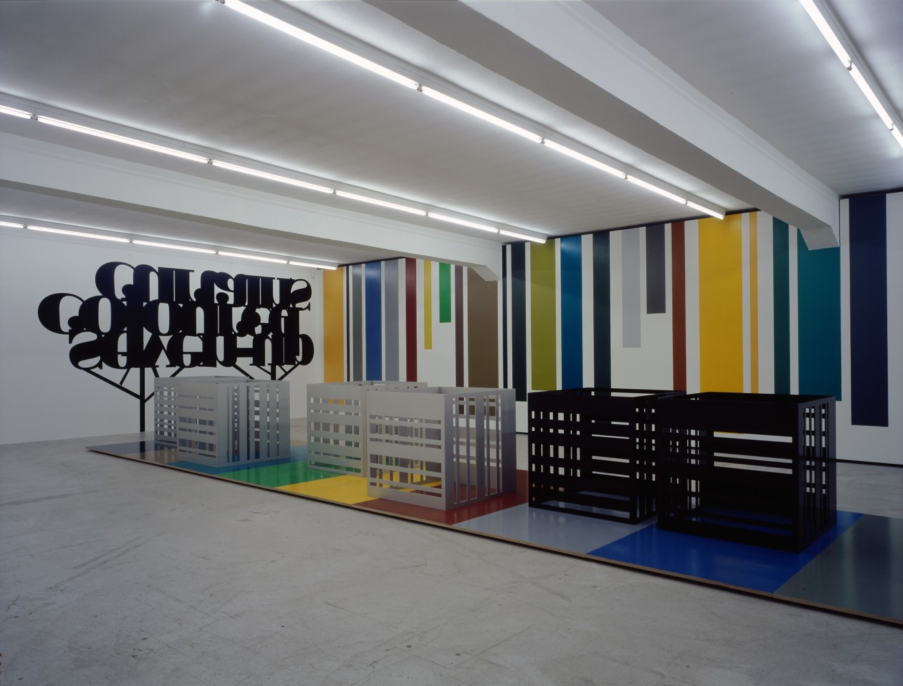 Installation view of Liam Gillick wall-based graphic work and sculpture exhibition