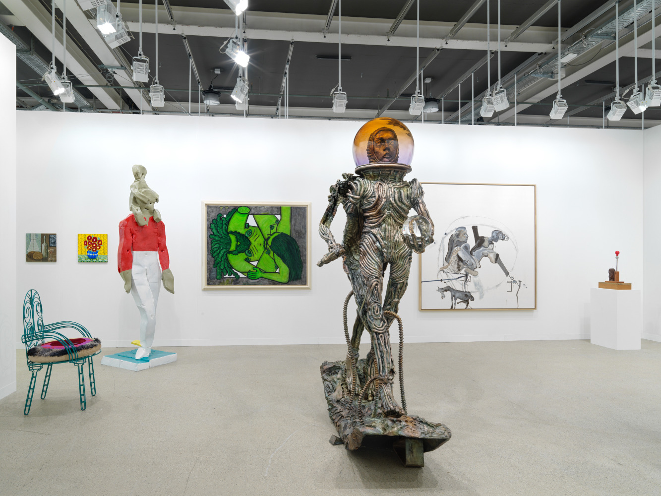 installation view of paintings and sculptures by various artists