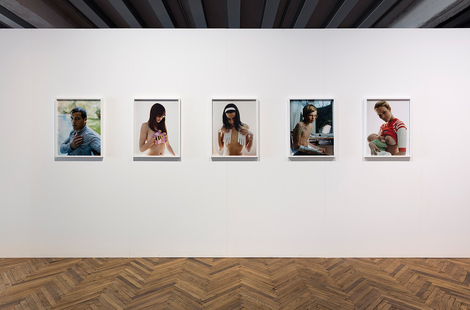 Installation view of photographs by Torbjørn Rødland