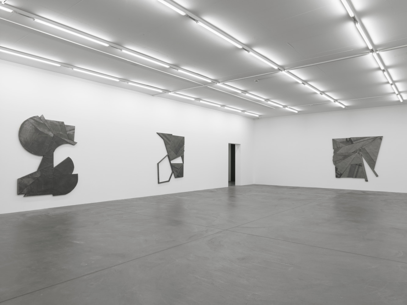 Installation view of Wyatt Kahn wall reliefs and photographs