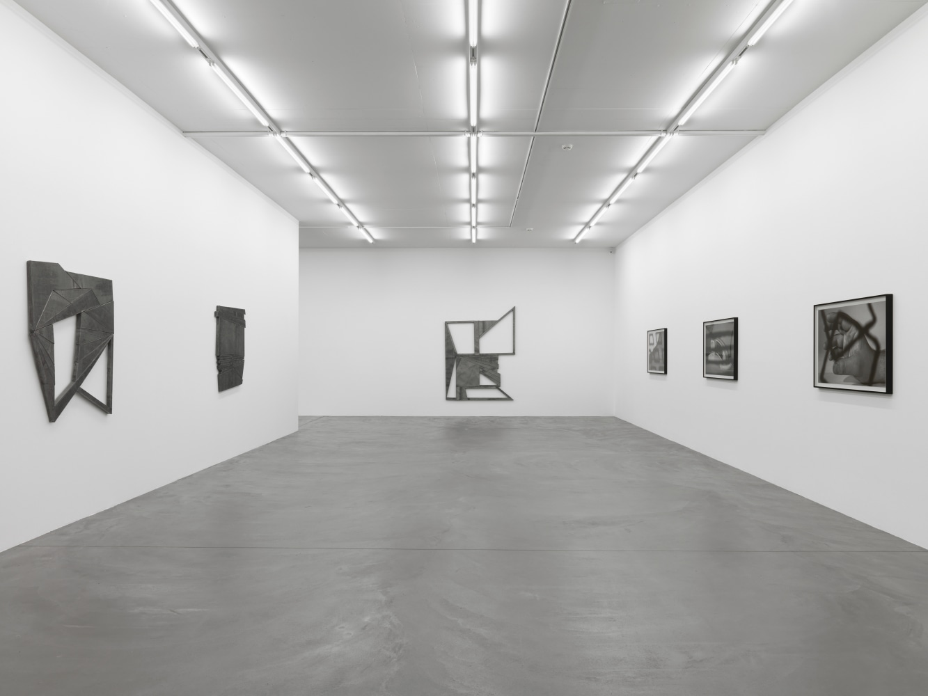 Installation view of Wyatt Kahn wall reliefs and photographs