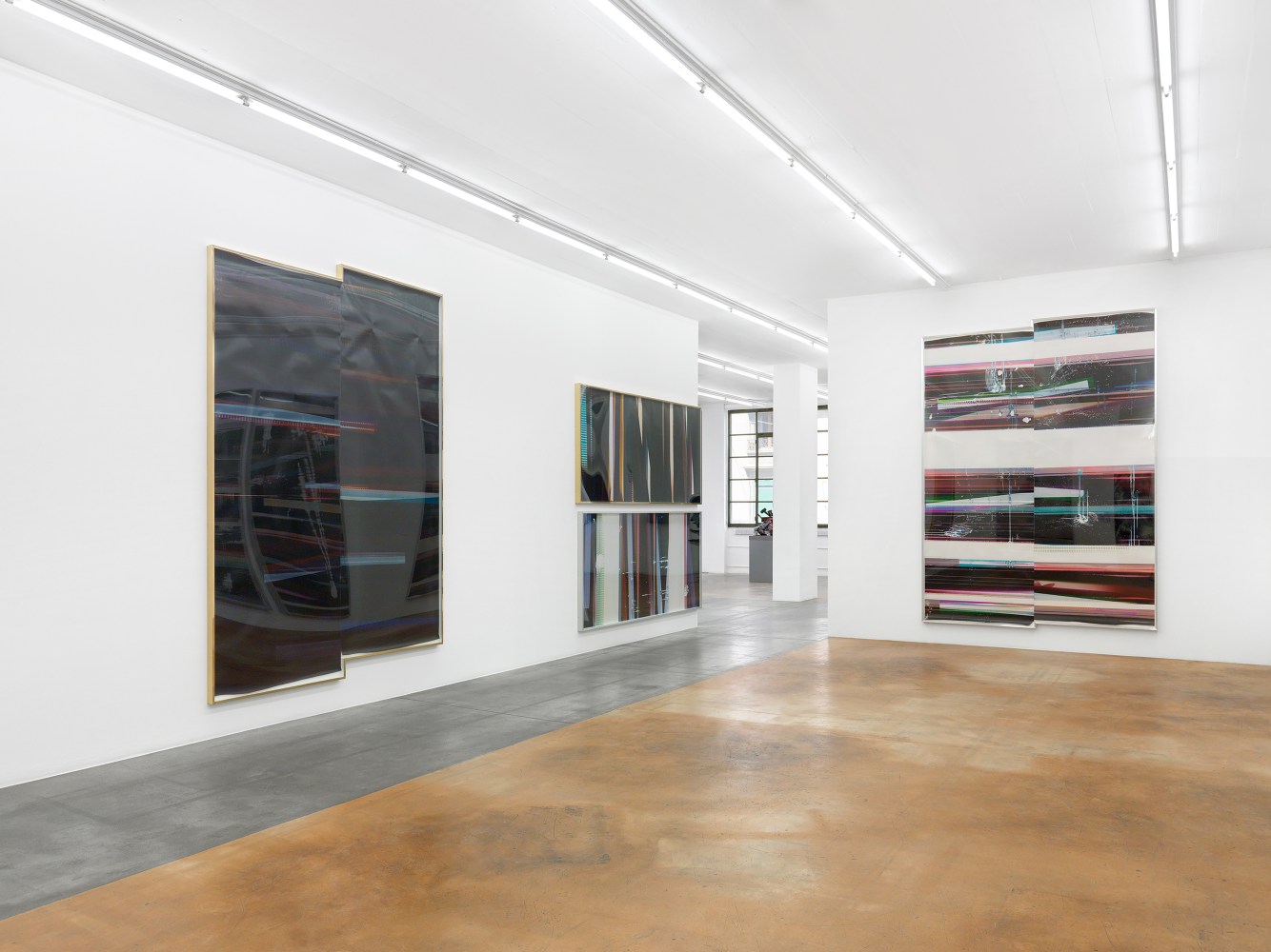 Installation view of wall works by Walead Beshty