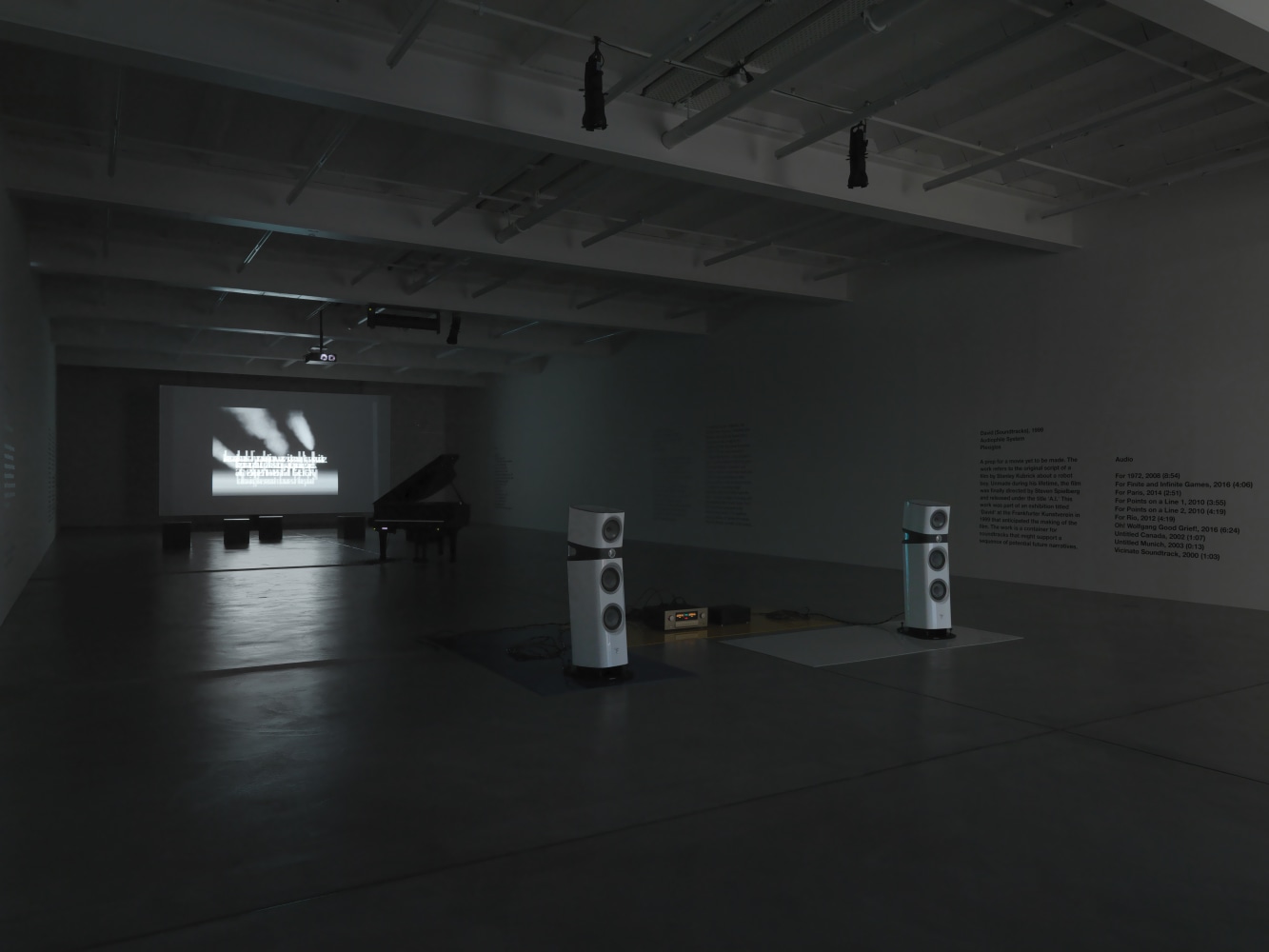 Installation view of Liam Gillick audio and film installation exhibition