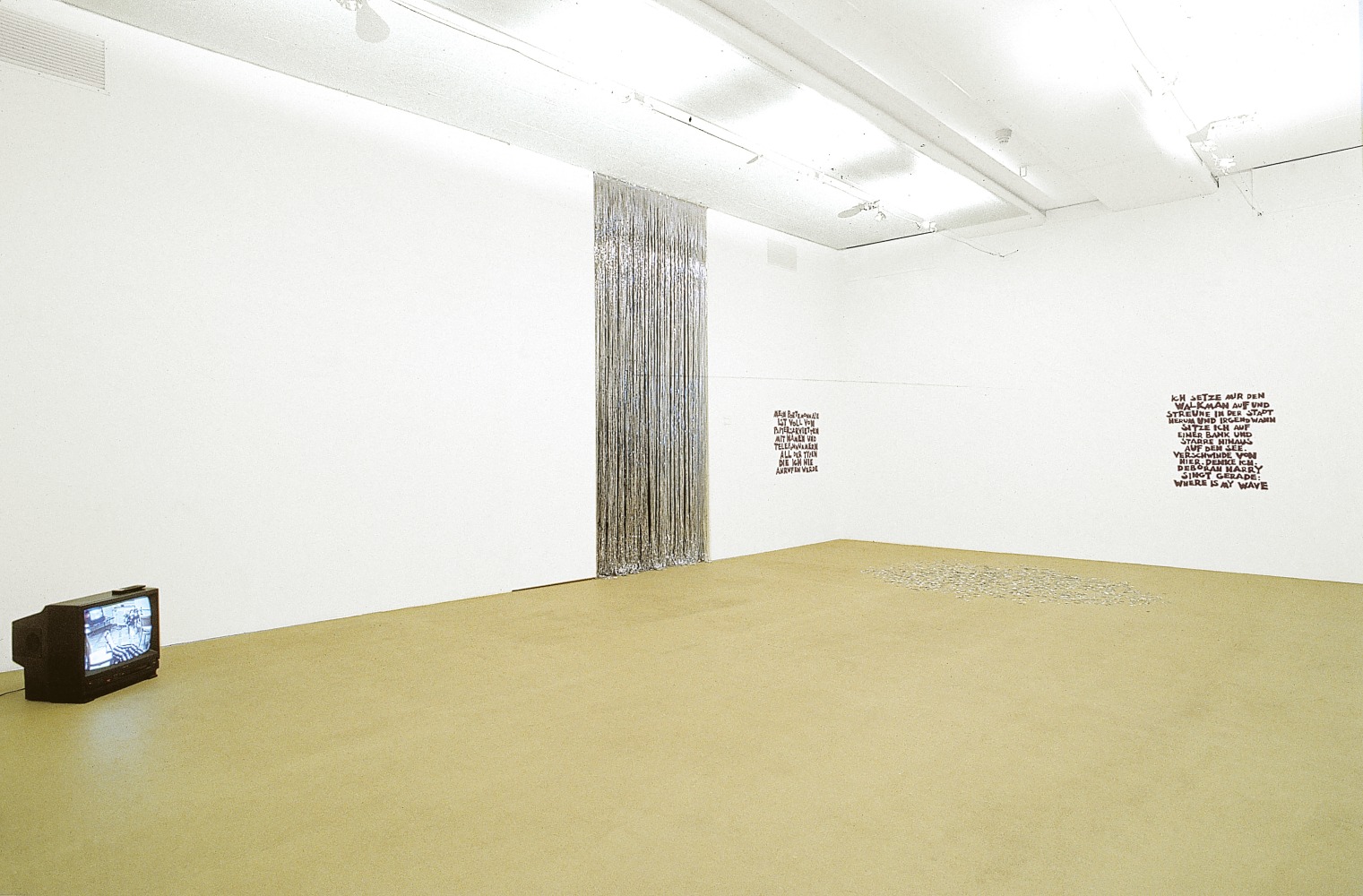 Installation view of sculptures and paintings by Ugo Rondinone