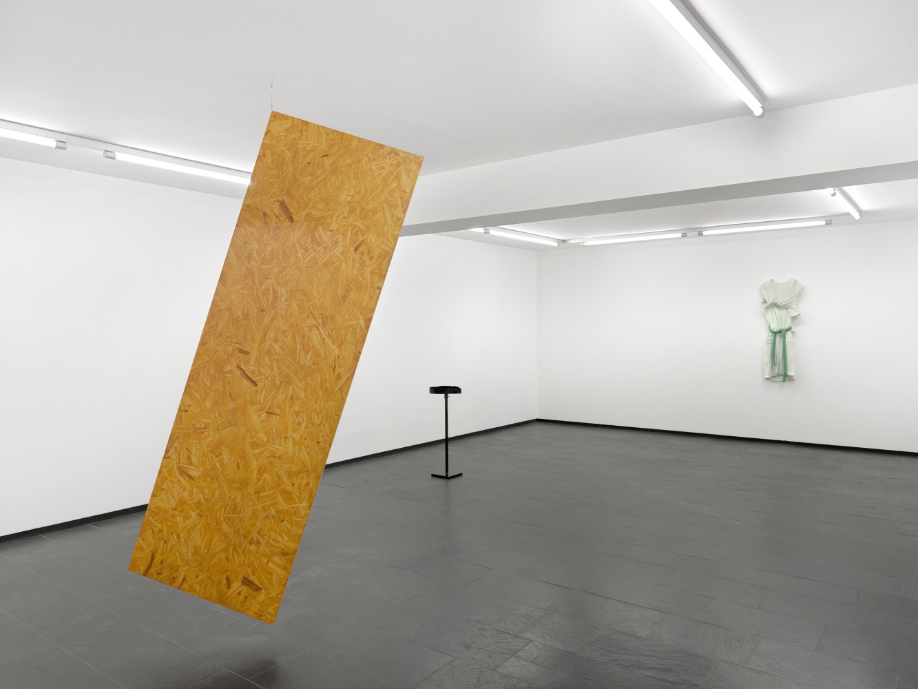 Installation view of paintings and sculptures by Valentin Carron