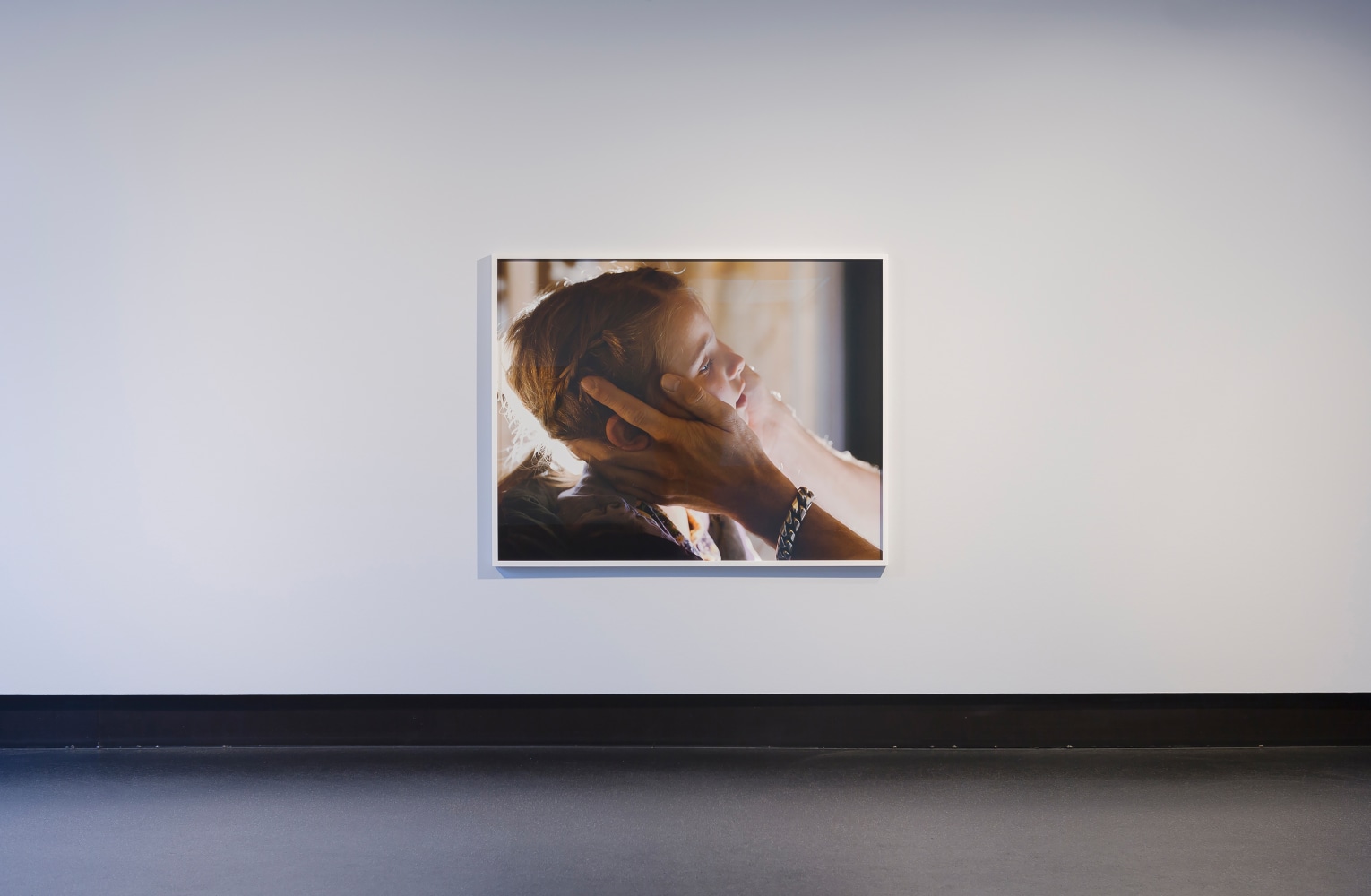 Installation view of photographs by Torbjørn Rødland