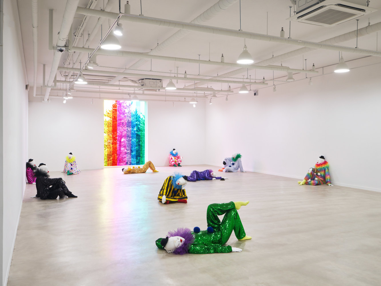 Installation view of clown sculptures by Ugo Rondinone