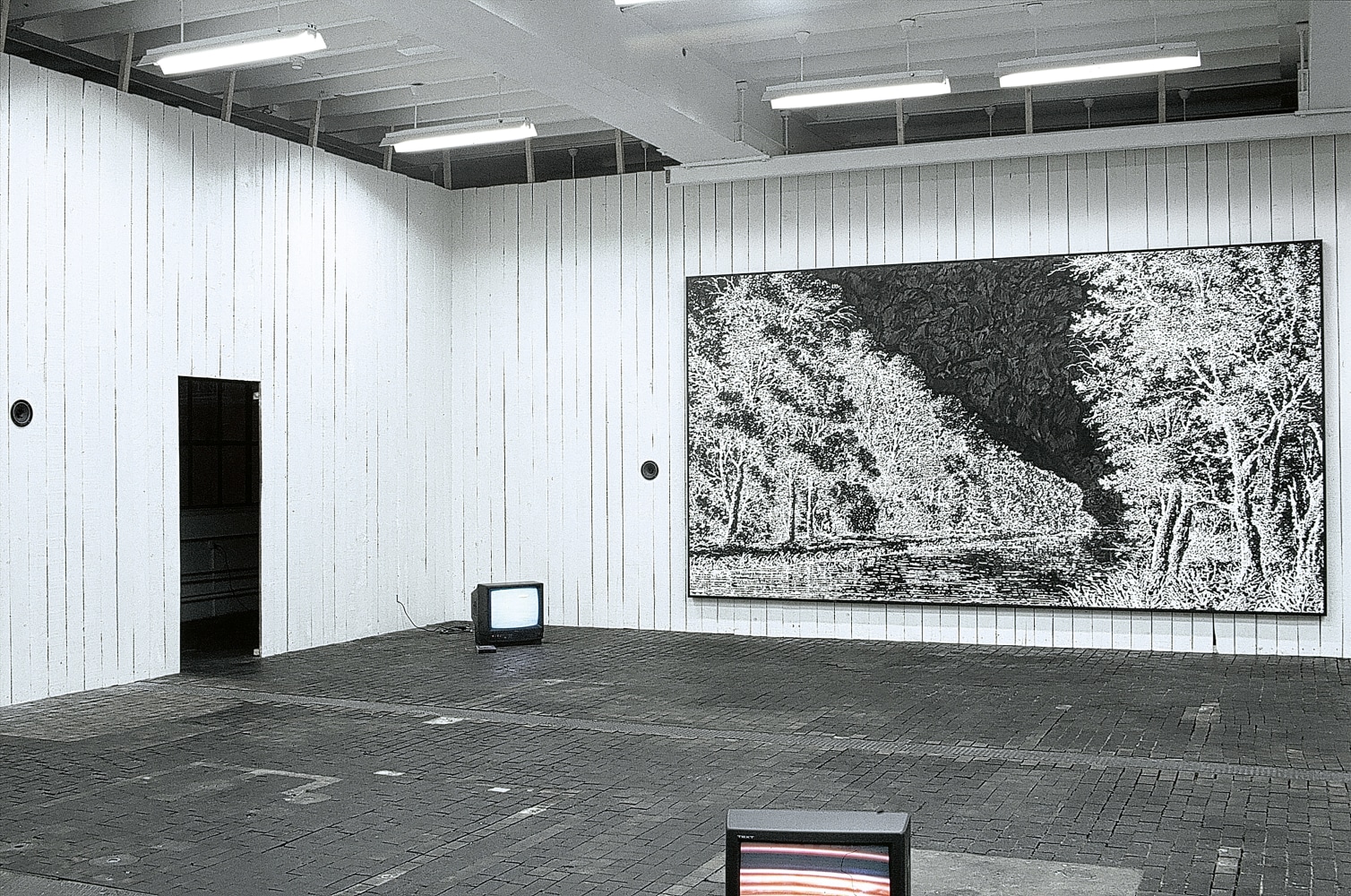 Installation view of painting and video works by Ugo Rondinone