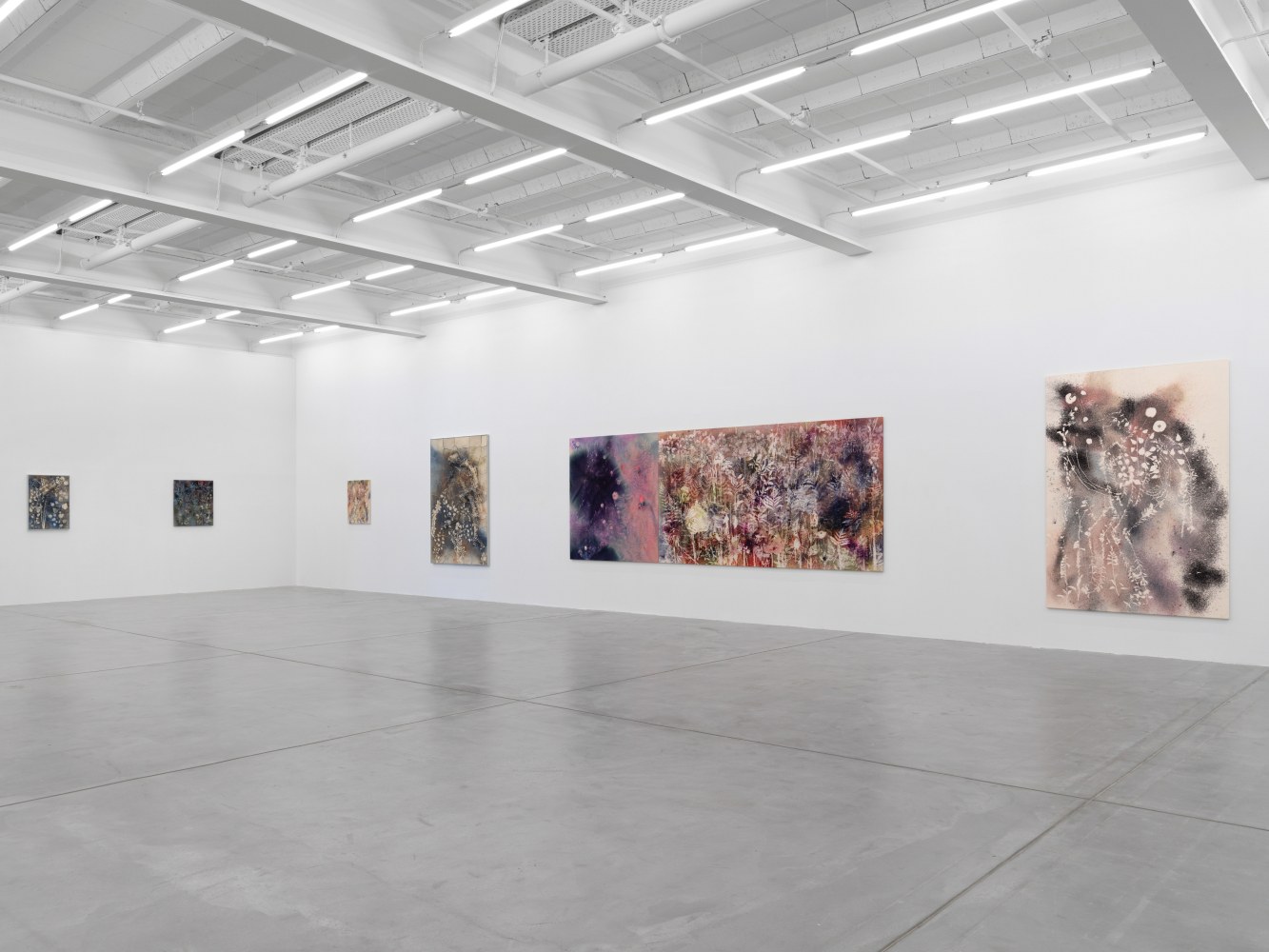 Installation view of Sam Falls paintings and ceramic reliefs exhibition