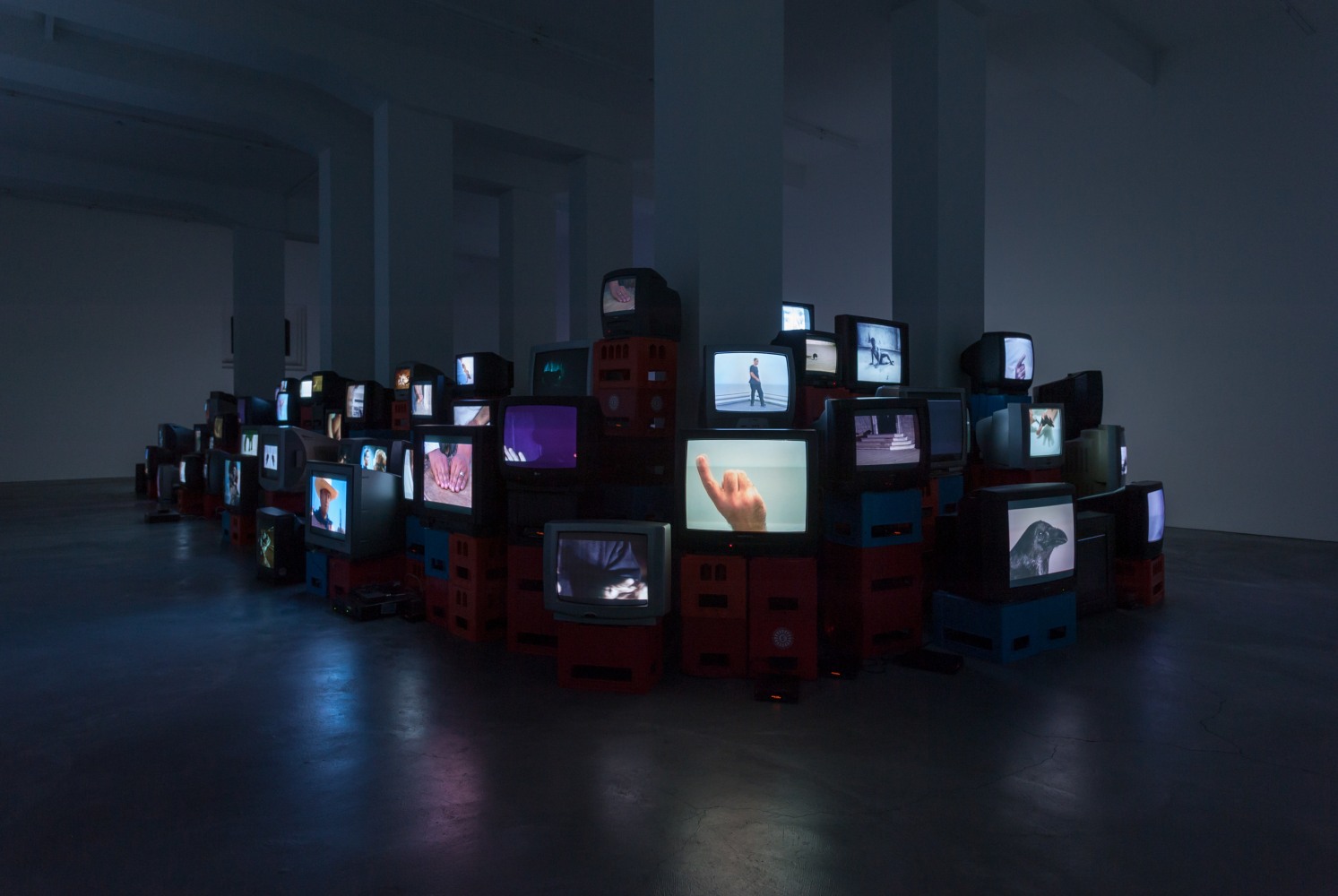 Douglas Gordon Pretty much every film and video work from about 1992 until now. 1999 82 video works on 101 TV monitors, video players, beer crates Installation 200 x 1530 x 620 cm / 78 3/4 x 602 3/8 x 244 1/8 in