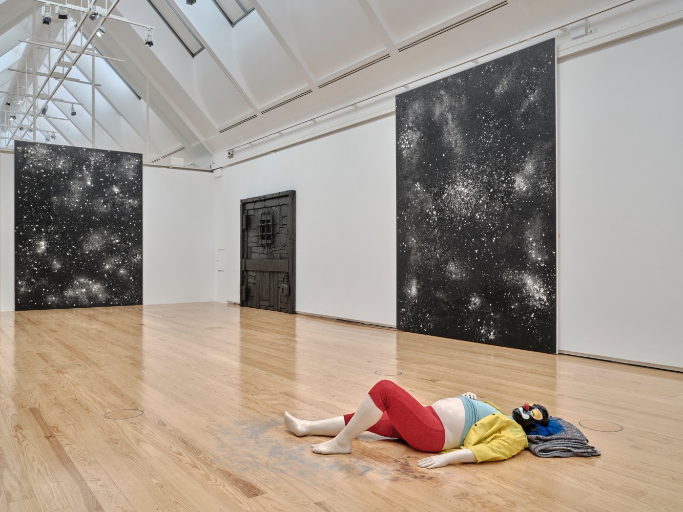 Installation view of paintings and sculptures by Ugo Rondinone