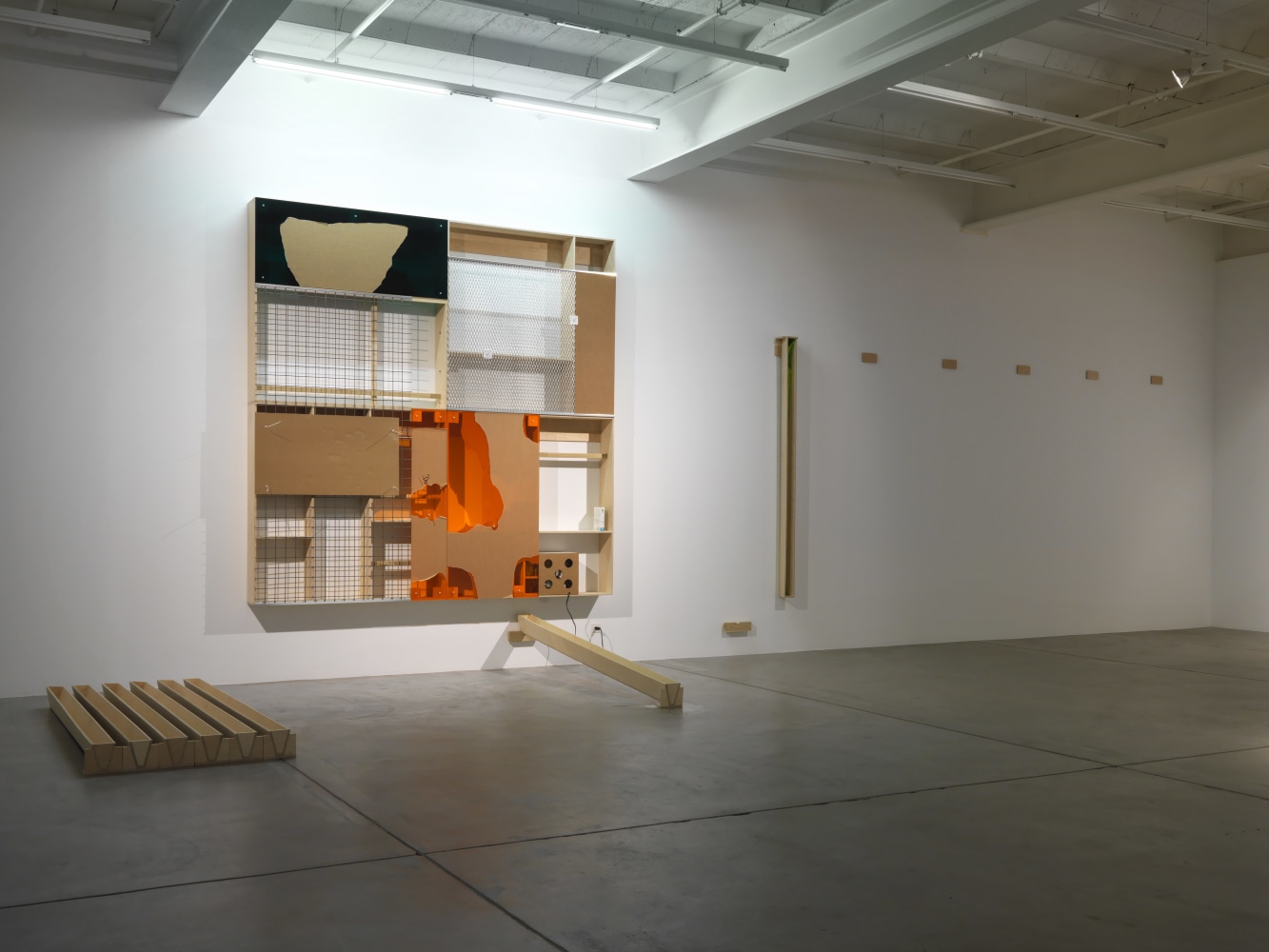 Installation view of Adam Pendleton and Pope.L wall-based works and sculptural installation