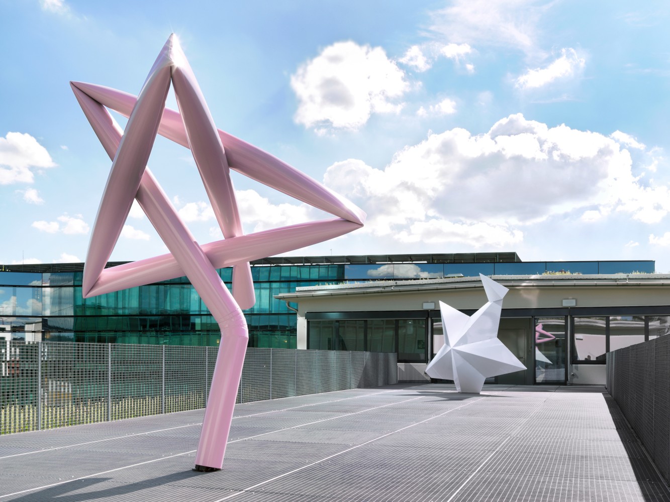 Installation view of two Mark Handforth sculptures on terrace