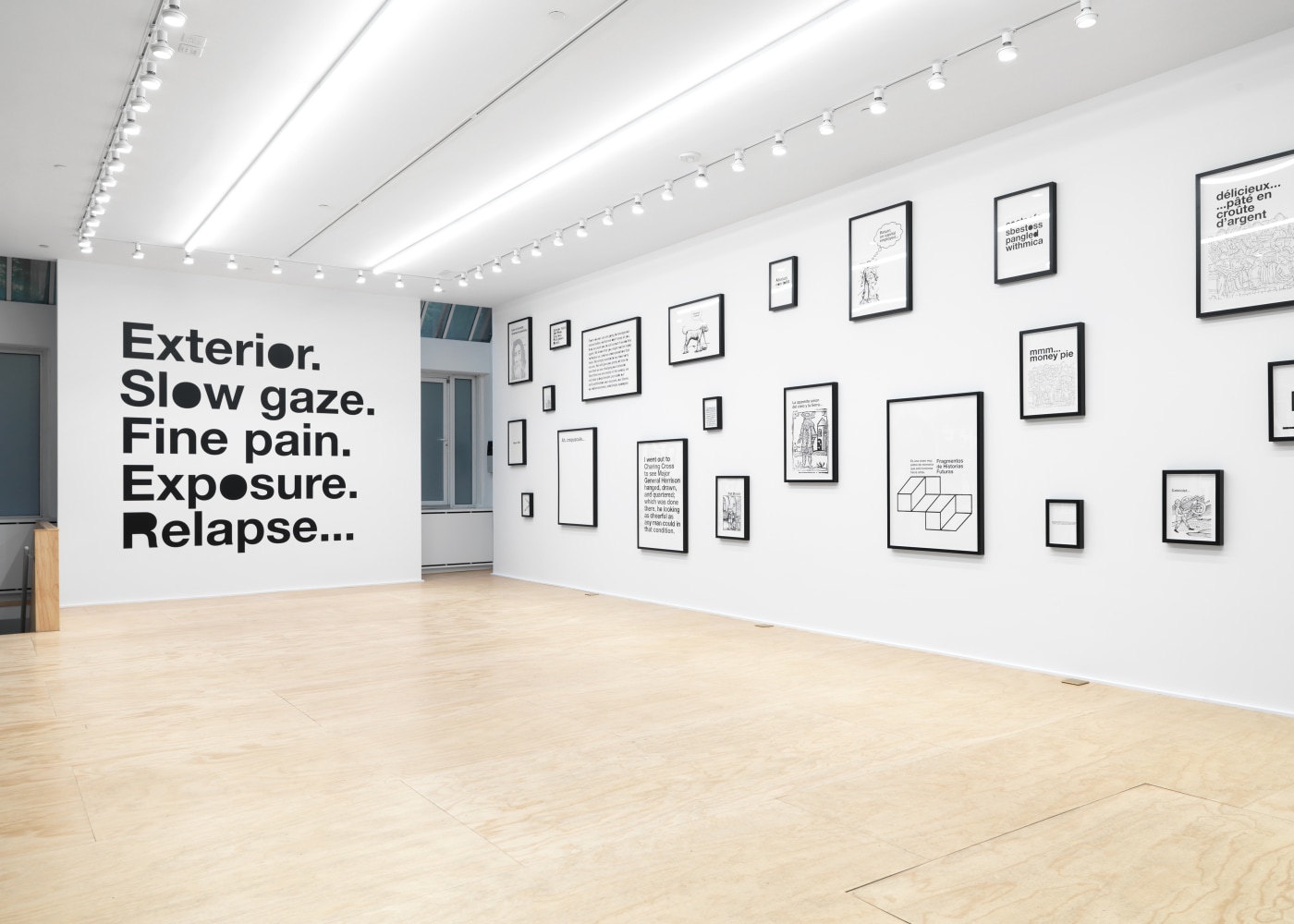 Installation view of Liam Gillick and Adam Pendleton films and wall-based works