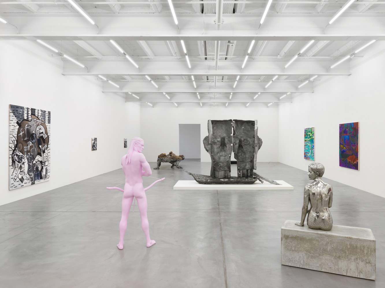 Installation view of group painting, sculpture, and film exhibition