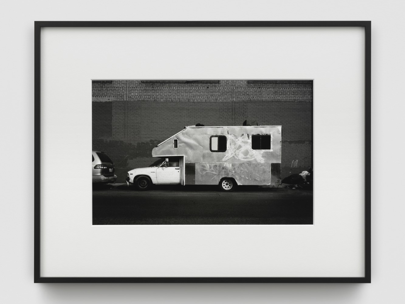 Black and white photograph of mobile homes by Walead Beshty