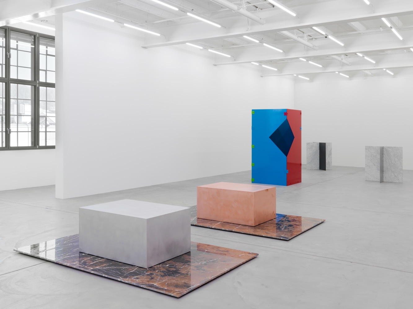 Installation view of Sam Falls paintings and sculptures exhibition