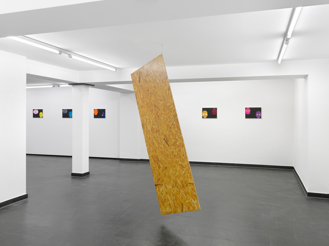 Installation view of paintings and sculptures by Valentin Carron