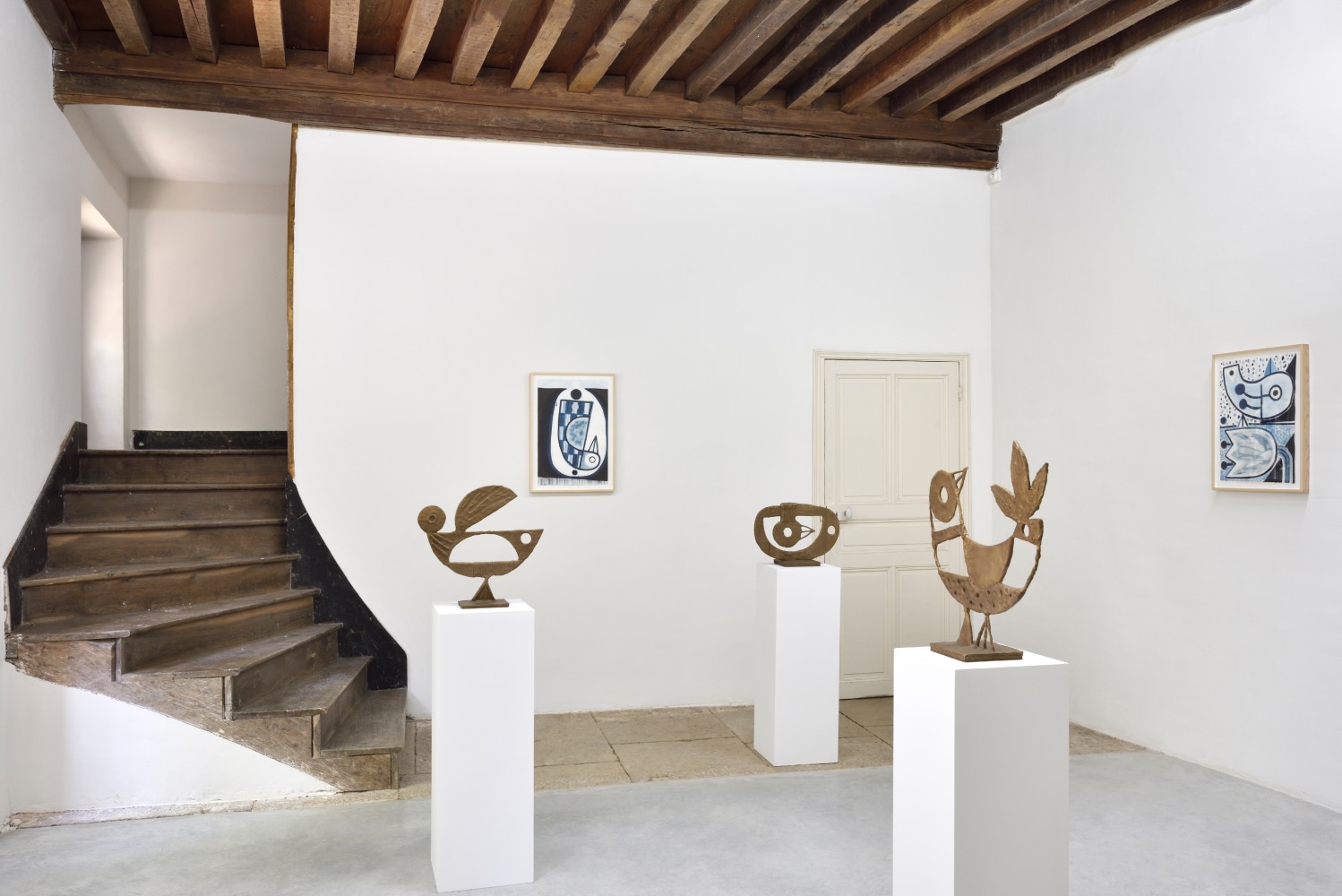 Installation view of paintings and sculptures by Austin Eddy