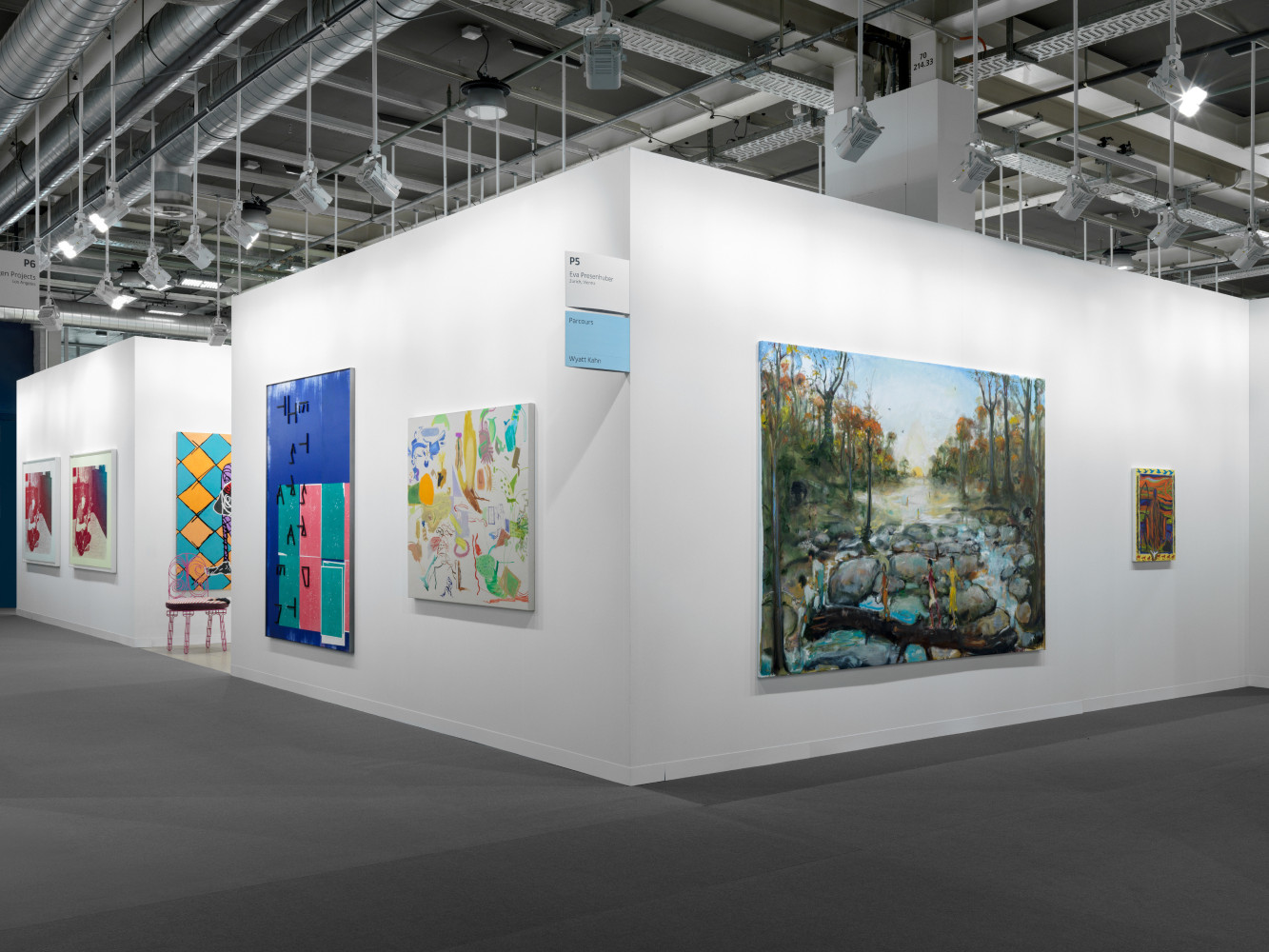 installation view of paintings and sculptures by various artists