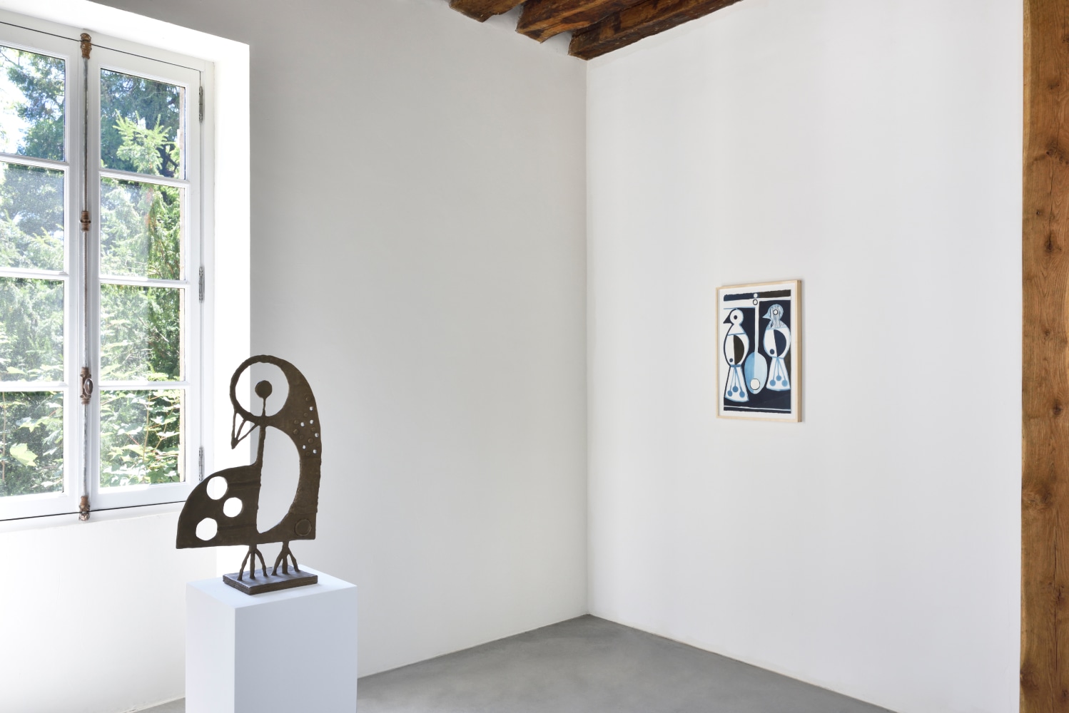 Installation view of paintings and sculptures by Austin Eddy