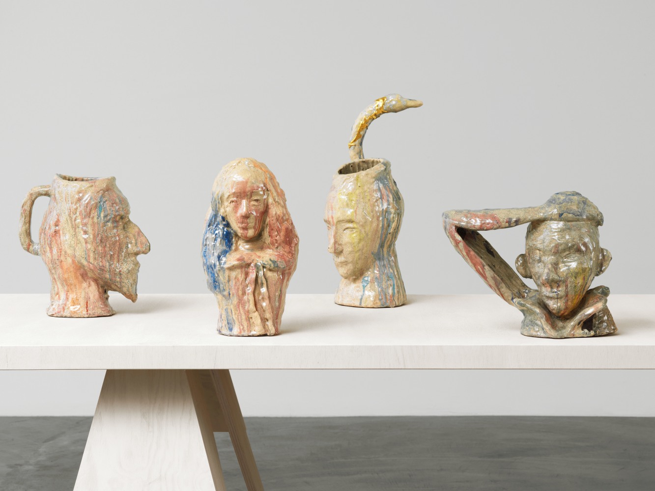 Group of sculptures by Andrew Lord on table