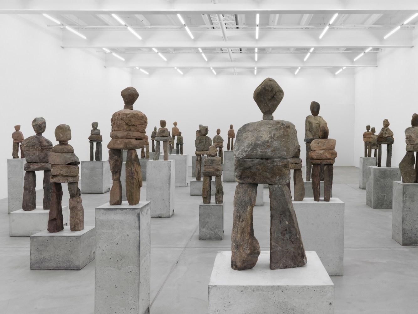 Installation view of Ugo Rondinone stone figure sculptures