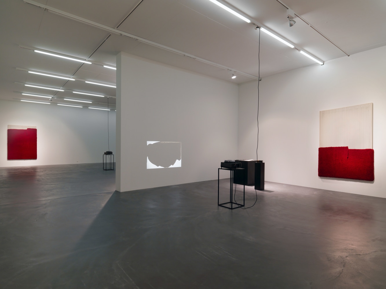 Installation view of paintings, video works and wall works by Latifa Echakhch
