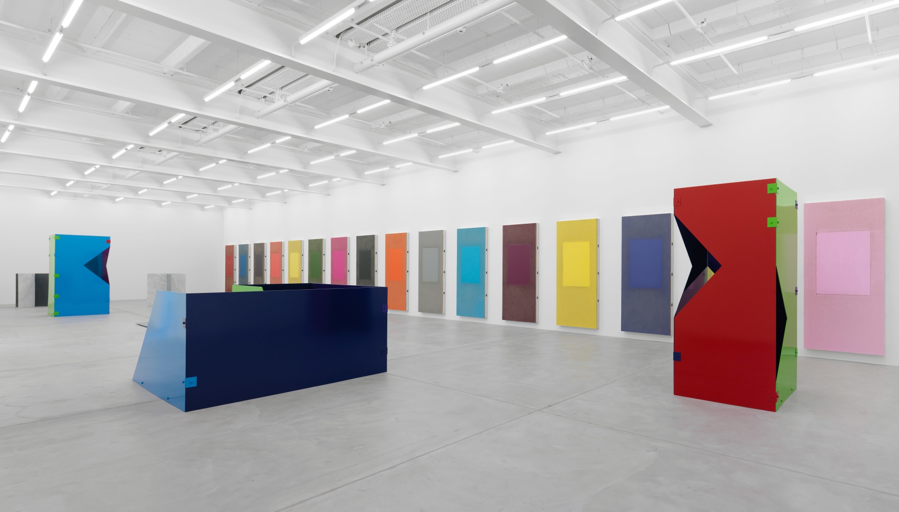 Installation view of Sam Falls paintings and sculptures exhibition