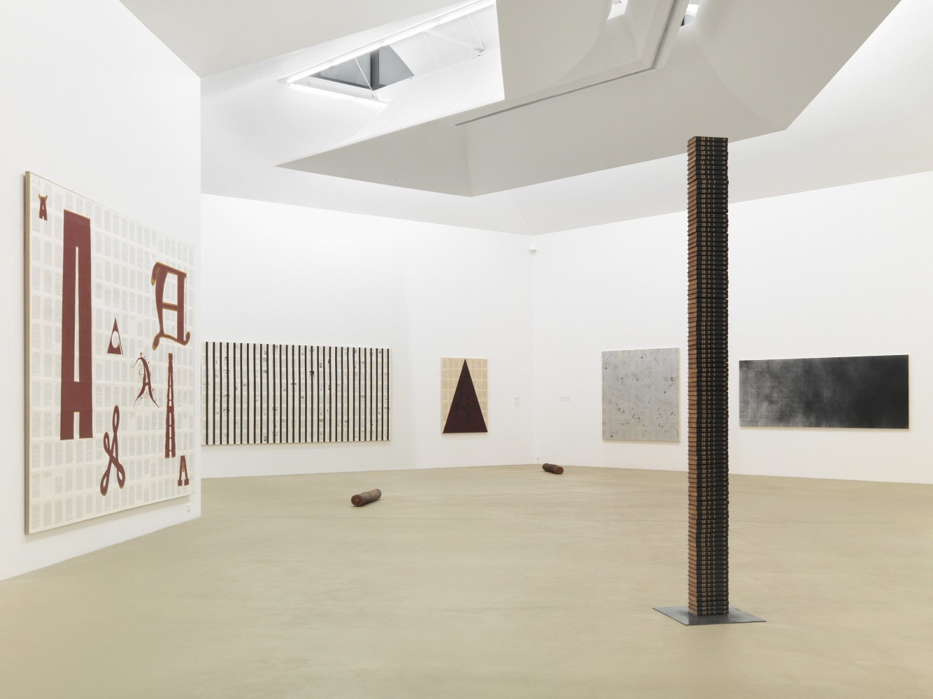 Installation view of paintings by Tim Rollins and K.O.S.