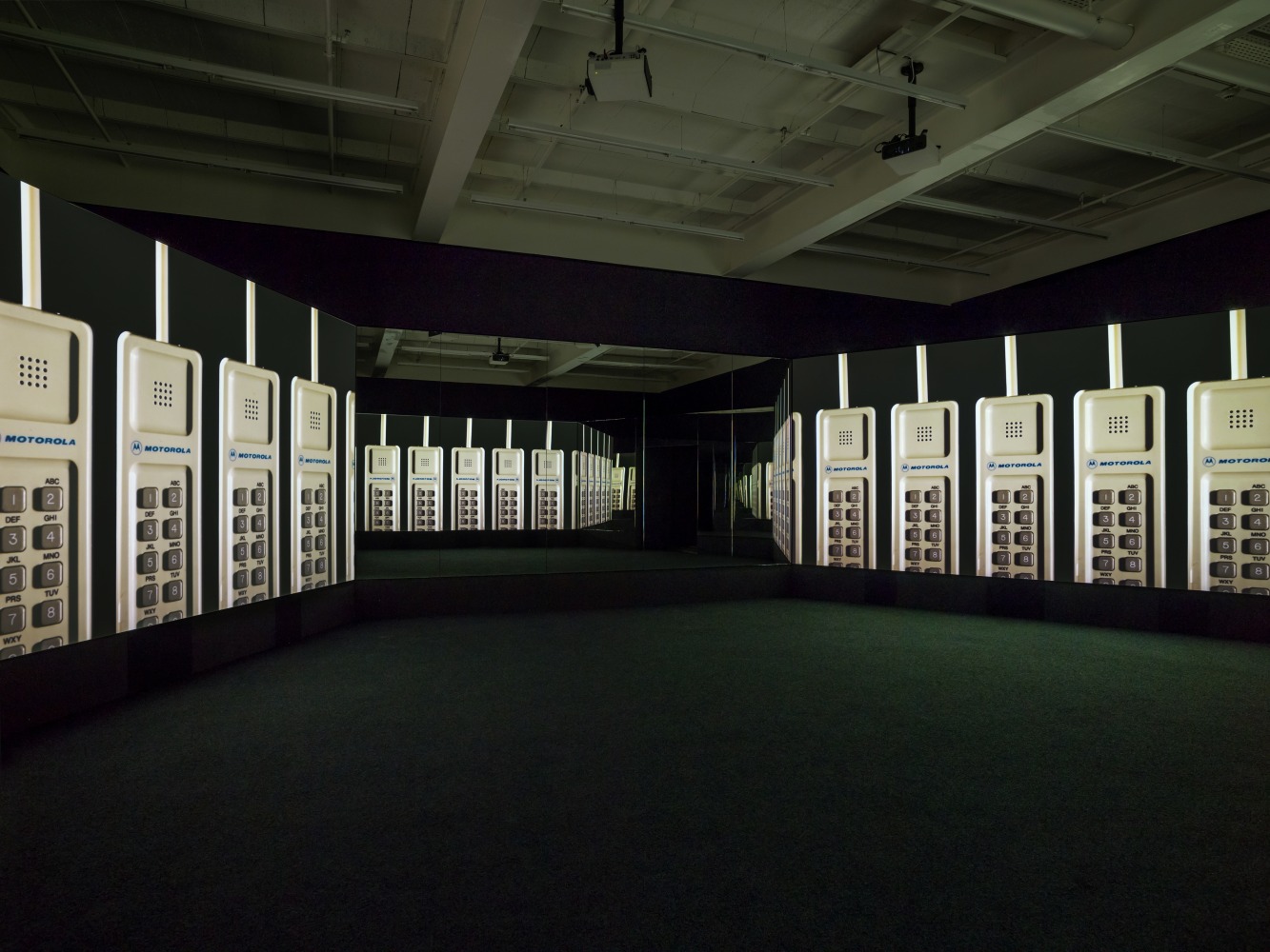 Video installation by Doug Aitken, NEW ERA 2018 Video installation with 3 channels of video (color, sound), 3 projections, freestanding room, PVC projection screens, mirrors 10:56 min / Loop Dimensions variable. Minimum room size approx 5 x 11 x 12 m