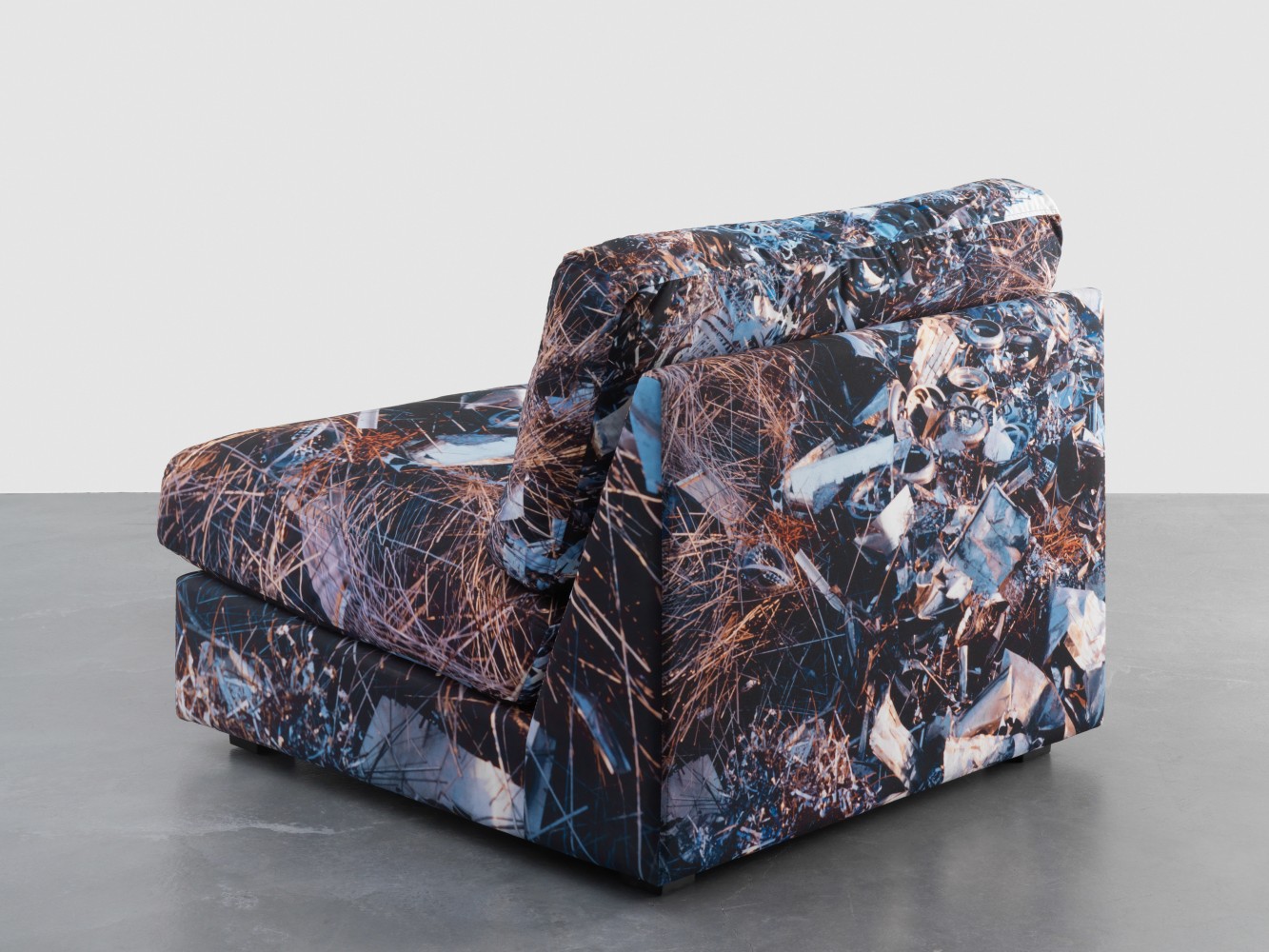 Sculpture by Doug Aitken, Earth Chair (technology junkyard, tokyo) 2015 Upholstered chair, printed fabric 83 x 90 x 98.5 cm / 32 5/8 x 35 3/8 x 38 3/4 in