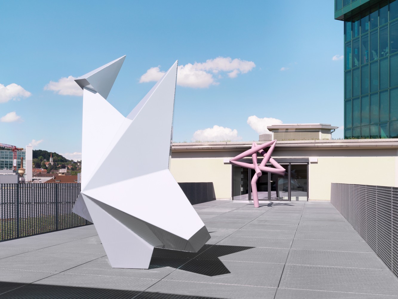 Installation view of two Mark Handforth sculptures on terrace