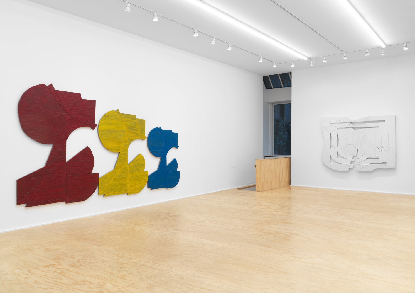 Installation view of Wyatt Kahn wall reliefs and works on paper