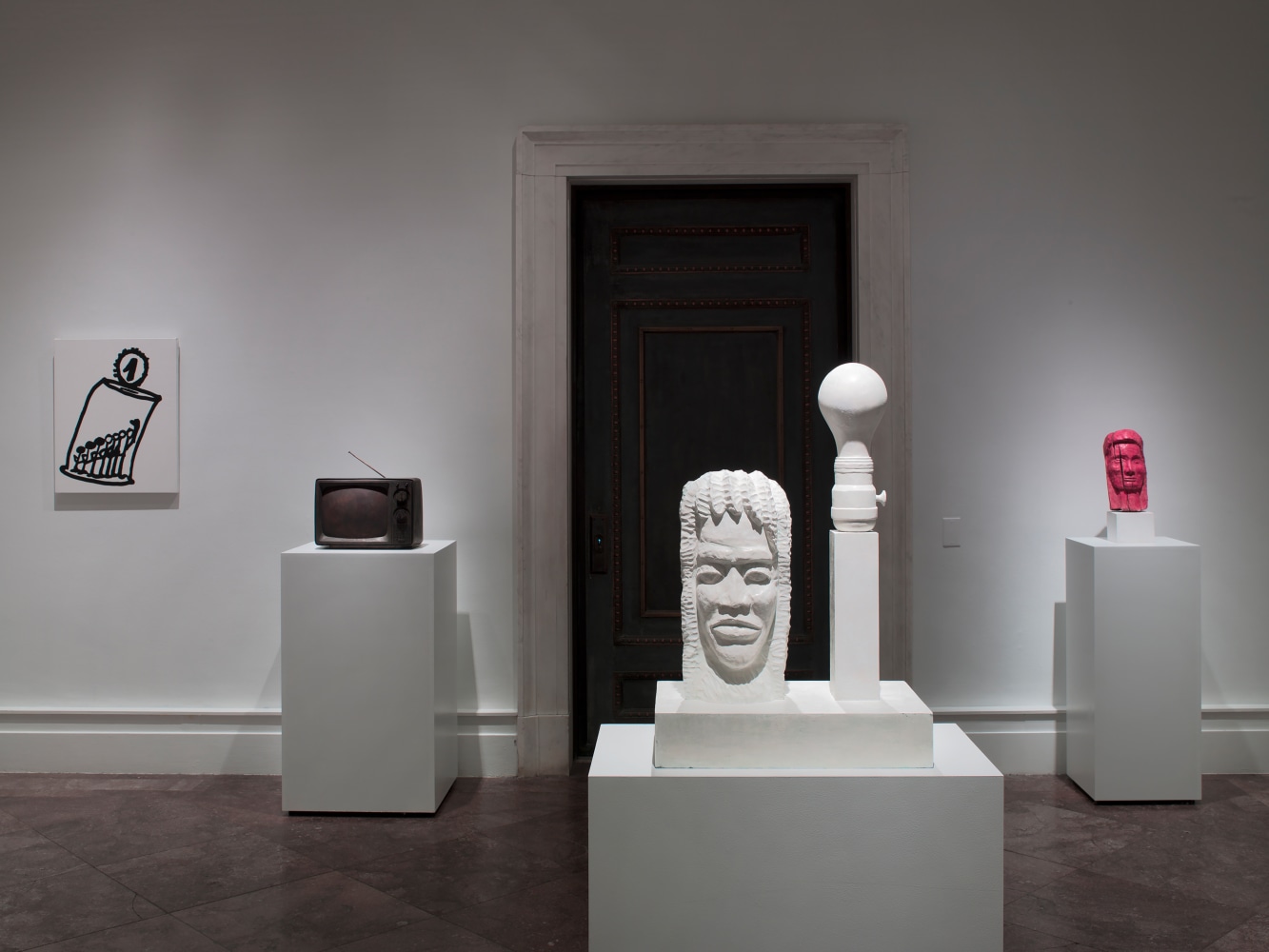 Installation view of paintings and sculptures by Joe Bradley