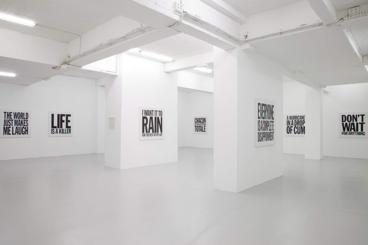 Installation view of wall works by John Giorno