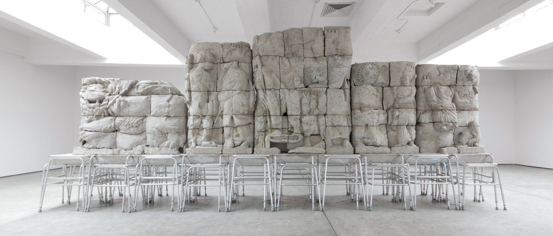 Indoor view of Justin Matherly sculpture, Handbook of inner culture for external barbarians (we nah beg no friend) 2013 Concrete, ambulatory equipment, spray paint 307 x 749 x 114 cm / 121 x 295 x 45 in