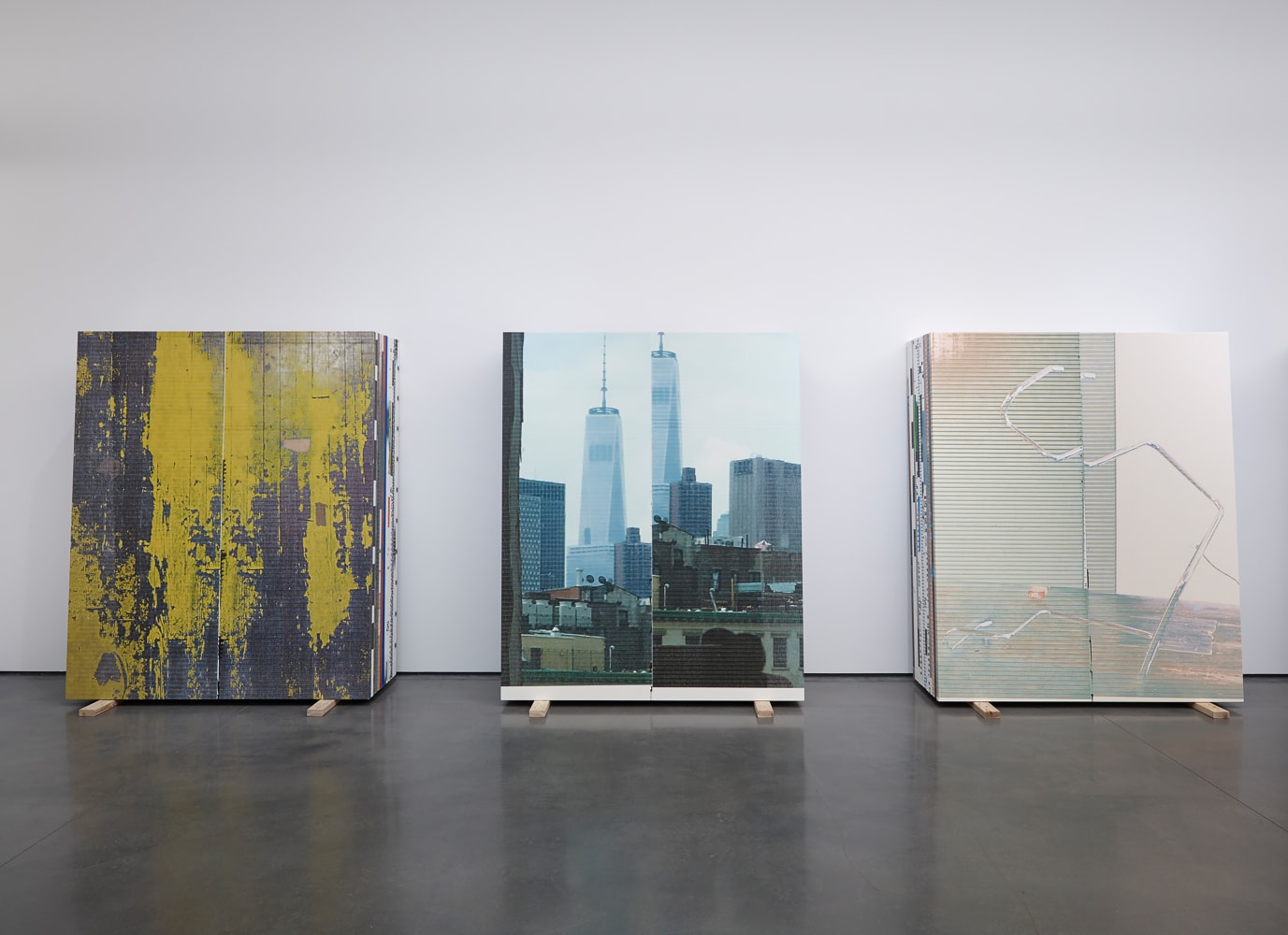 Installation view of sculptures by Peter Fischli and David Weiss and works by Wade Guyton