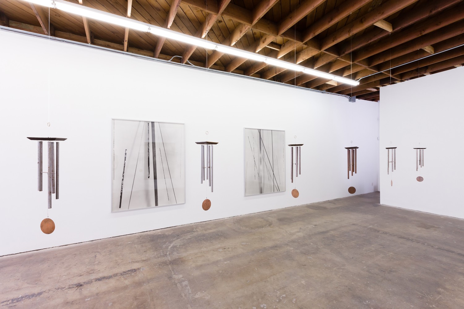 Installation view of paintings and sculptures by Sam Falls