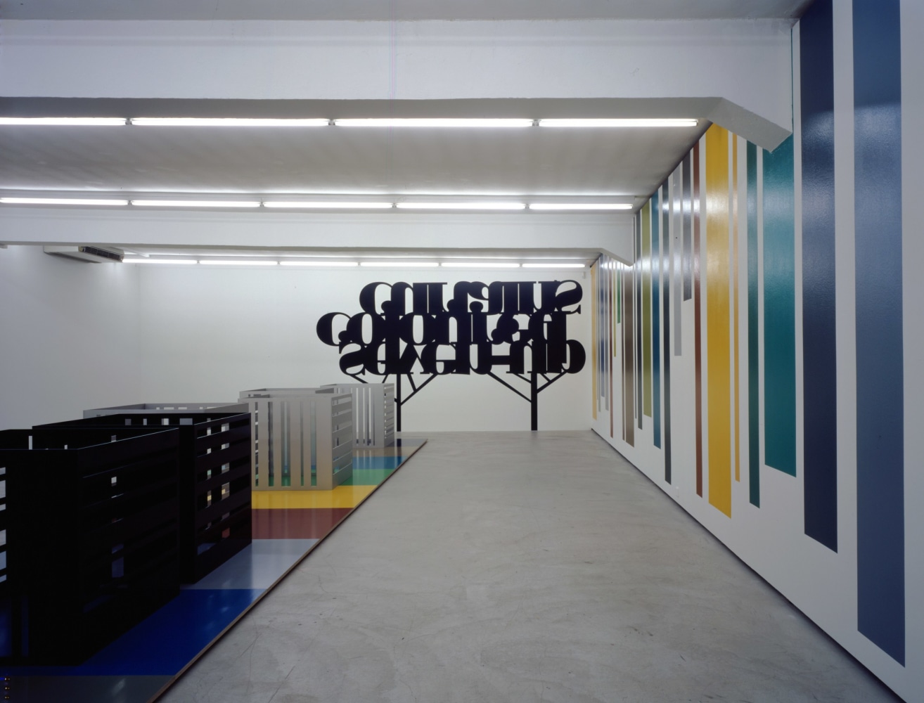 Installation view of Liam Gillick wall-based graphic work and sculpture exhibition