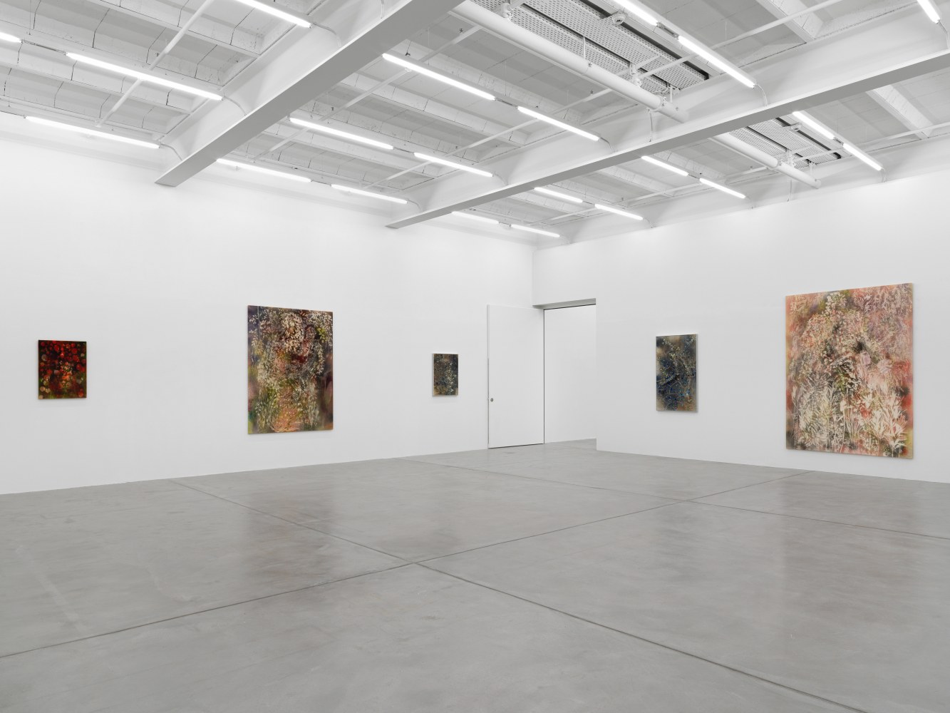 Installation view of Sam Falls paintings and ceramic reliefs exhibition